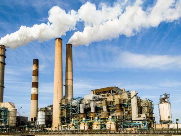 photo of an industrial factory emitting smoke