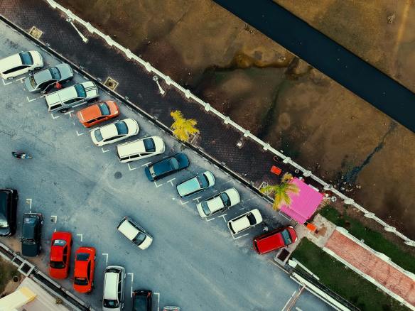 bird s eye view of parked cars